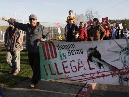no-human-is-illegal-sign-immigration-rally-Reuters (1)